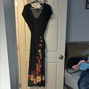 Dress, black short sleeve with floral designs on front and back. Size 18/20